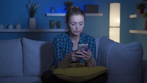 The-woman-texting-on-the-phone-at-night-is-unhappy-and-sad.